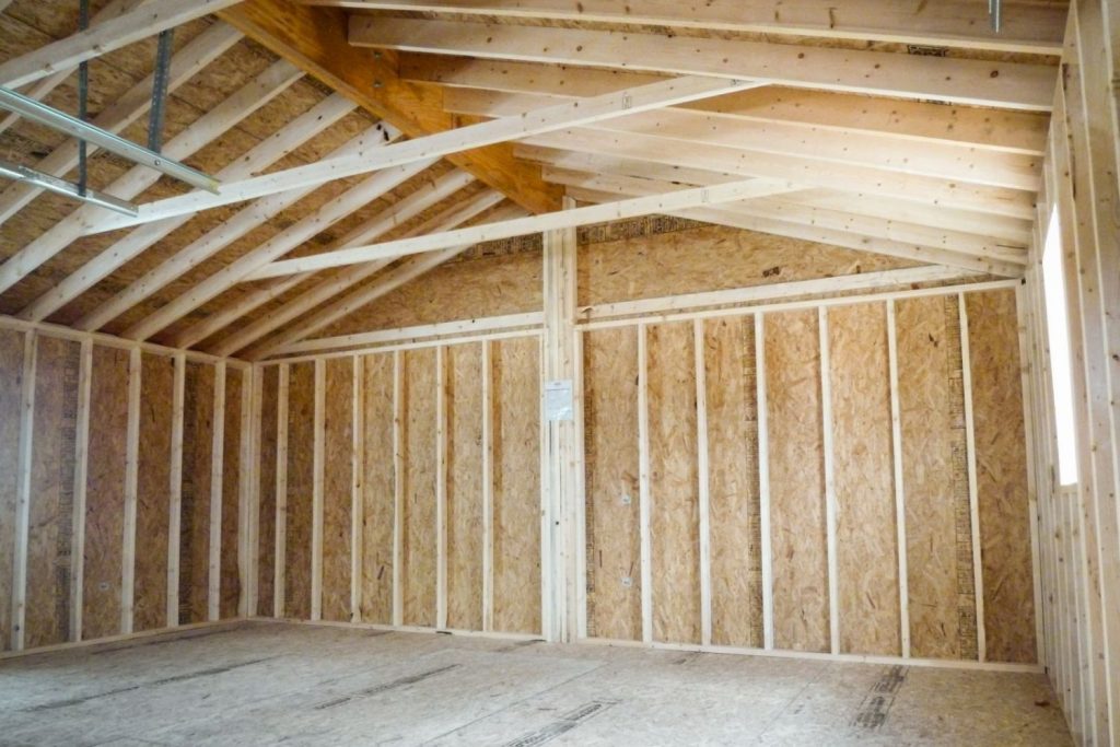 A room featuring wooden framing and a visible ceiling, showcasing a rustic architectural design.